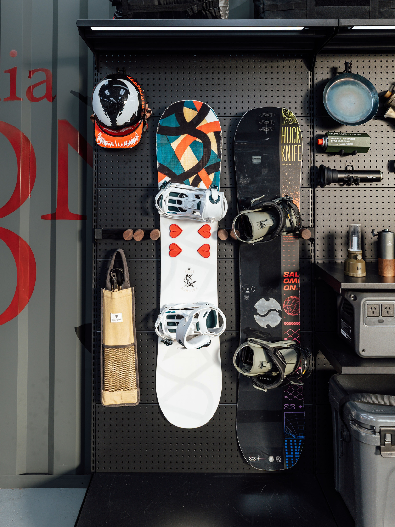 PegGrid storage wall displaying snowboards, helmets and outdoor equipment, photographed by Cas Gao